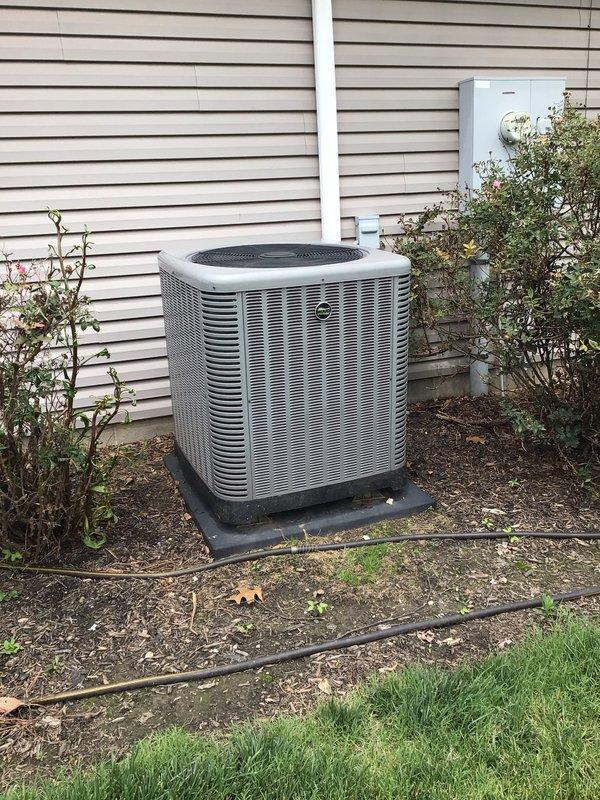 # HVAC Service Report

Responded to residential service call for air conditioning unit experiencing freeze-up conditions during operation. Upon arrival, located outdoor condensing unit positioned on side of residence. Unit identified as Rheem/Ruud model RP14GJA11NA, manufactured June 2018, single-phase 208/230V system.

Performed comprehensive diagnostic evaluation to determine root cause of icing condition. Inspected outdoor condenser unit for proper airflow, refrigerant levels, and component operation. Verified unit specifications and operational parameters against manufacturer nameplate data. Checked electrical connections at outdoor disconnect and service panel for proper voltage supply.

Evaluated potential causes including restricted airflow, low refrigerant charge, dirty evaporator coil, malfunctioning blower motor, or faulty metering device. Assessed condenser coil condition and clearances around unit. Documented unit serial number W231838434 and system specifications for servi