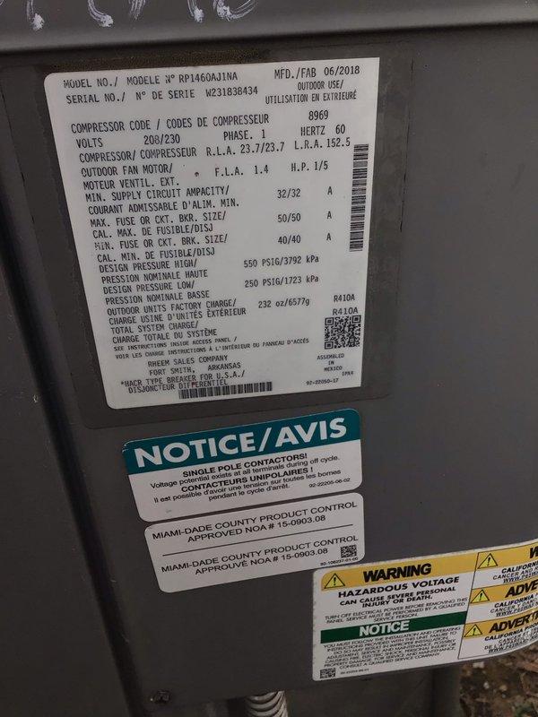 # HVAC Service Report

Responded to residential service call for air conditioning unit experiencing freeze-up conditions during operation. Upon arrival, located outdoor condensing unit positioned on side of residence. Unit identified as Rheem/Ruud model RP14GJA11NA, manufactured June 2018, single-phase 208/230V system.

Performed comprehensive diagnostic evaluation to determine root cause of icing condition. Inspected outdoor condenser unit for proper airflow, refrigerant levels, and component operation. Verified unit specifications and operational parameters against manufacturer nameplate data. Checked electrical connections at outdoor disconnect and service panel for proper voltage supply.

Evaluated potential causes including restricted airflow, low refrigerant charge, dirty evaporator coil, malfunctioning blower motor, or faulty metering device. Assessed condenser coil condition and clearances around unit. Documented unit serial number W231838434 and system specifications for servi