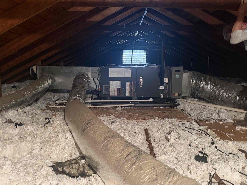 Completed installation of 2-ton, 19 SEER heat pump system in single-family residence. Installed new air handler unit in attic space on elevated platform with proper clearances, connected flexible ductwork throughout attic to existing distribution system, and ensured adequate insulation coverage around equipment. Positioned outdoor heat pump condenser unit on concrete pad against building exterior, established electrical connections via wall-mounted disconnect box, ran refrigerant lines and condensate drainage, and verified all components operational per manufacturer specifications.