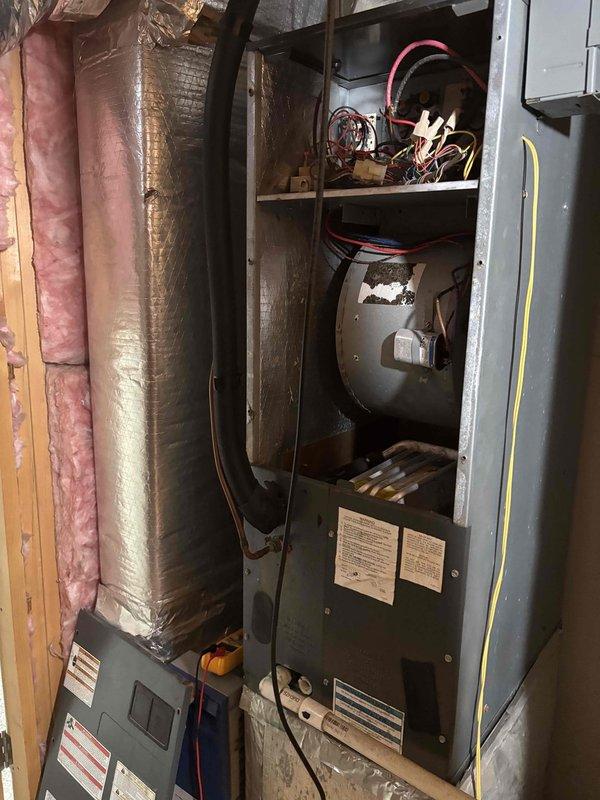 Responded to no-cool complaint on 4-year-old upstairs HVAC system that was completely inoperative. Upon arrival, thermostat displayed 87°F actual temperature with 77°F cooling setpoint in hold mode, indicating system failure to maintain desired temperature. Performed diagnostic evaluation of furnace and air handler components, inspecting blower motor assembly, electrical connections, wiring harnesses, and control boards. Verified no tripped breakers and confirmed proper power supply to unit. Identified system malfunction preventing compressor operation and restored cooling functionality to upstairs zone, returning system to normal operating parameters.