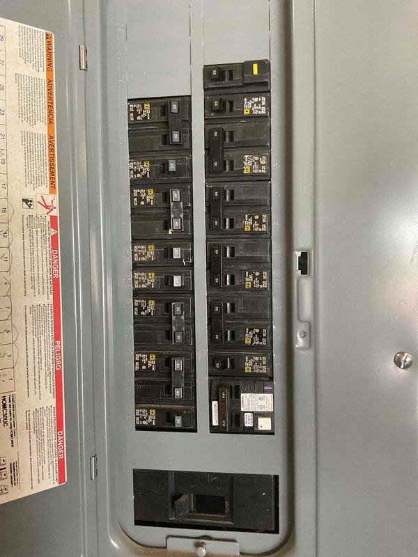 Conducted HVAC system replacement estimate at residential property. Documented existing outdoor condensing unit positioned on concrete pad adjacent to brick exterior wall, along with electrical service panel and disconnect configuration. Photographed current equipment specifications, electrical infrastructure, and installation conditions to provide comprehensive assessment for complete system replacement recommendation.