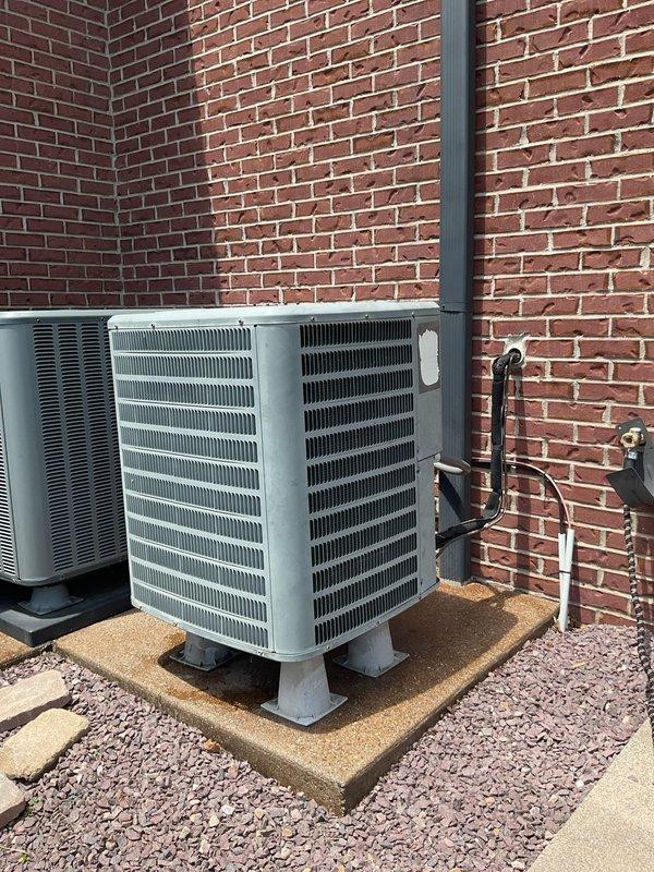 Completed comprehensive HVAC system replacement estimate for existing dual outdoor condenser unit installation mounted on concrete pads against brick exterior. Assessed current upflow configuration including furnace, evaporator coil, and plenum components with detailed dimensional measurements for proper equipment sizing and compatibility. Documented existing installation specifications, base conditions, and structural requirements to provide accurate replacement recommendations for complete system upgrade.