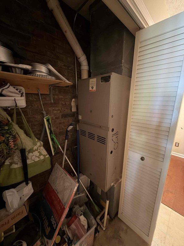 Responded to no-cooling call for 20+ year old residential AC system. Upon arrival, confirmed outdoor condensing unit was not operating. Performed diagnostic evaluation of both indoor furnace/air handler and outdoor condenser. Unit showed signs of age-related wear consistent with equipment exceeding its expected service life. Documented existing equipment configuration with indoor air handler located in utility closet and outdoor condensing unit positioned on exterior paver pad with adequate clearance. System evaluation revealed unit had reached end of serviceable life expectancy. Provided customer with assessment findings and discussed replacement options for aged equipment. Recommended full system replacement due to age, efficiency considerations, and reliability concerns typical of HVAC systems operating beyond 15-20 year lifespan.