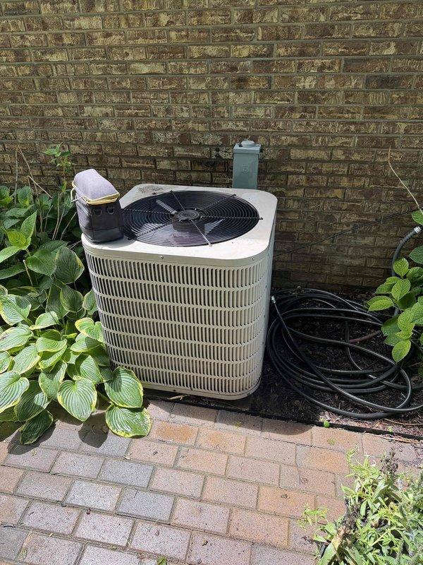Responded to no-cooling call for 20+ year old residential AC system. Upon arrival, confirmed outdoor condensing unit was not operating. Performed diagnostic evaluation of both indoor furnace/air handler and outdoor condenser. Unit showed signs of age-related wear consistent with equipment exceeding its expected service life. Documented existing equipment configuration with indoor air handler located in utility closet and outdoor condensing unit positioned on exterior paver pad with adequate clearance. System evaluation revealed unit had reached end of serviceable life expectancy. Provided customer with assessment findings and discussed replacement options for aged equipment. Recommended full system replacement due to age, efficiency considerations, and reliability concerns typical of HVAC systems operating beyond 15-20 year lifespan.