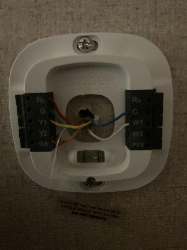 Conducted comprehensive HVAC system replacement estimate for residential property with existing system experiencing refrigerant leak. Performed thorough inspection of current equipment, documenting aging indoor evaporator coil assembly showing visible corrosion, discoloration, and deterioration of copper refrigerant lines and insulation. Evaluated existing thermostat wiring configuration, identifying proper terminal connections for multi-stage heating and cooling system with heat pump capabilities. Assessed equipment accessibility, cabinet condition, and installation requirements for complete system replacement recommendation.