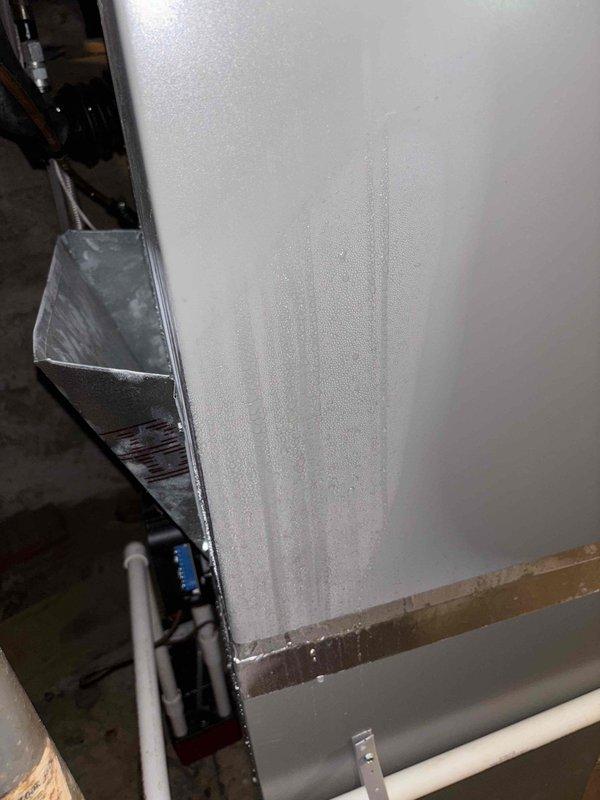 Responded to return visit for complete loss of cooling on less-than-one-year-old system with no ice buildup observed. Upon inspection, found dirty air filter restricting airflow, as evidenced by condensation on unit cabinet and heavily loaded filter media. Replaced air filter and verified proper system operation, restoring cooling to entire home.