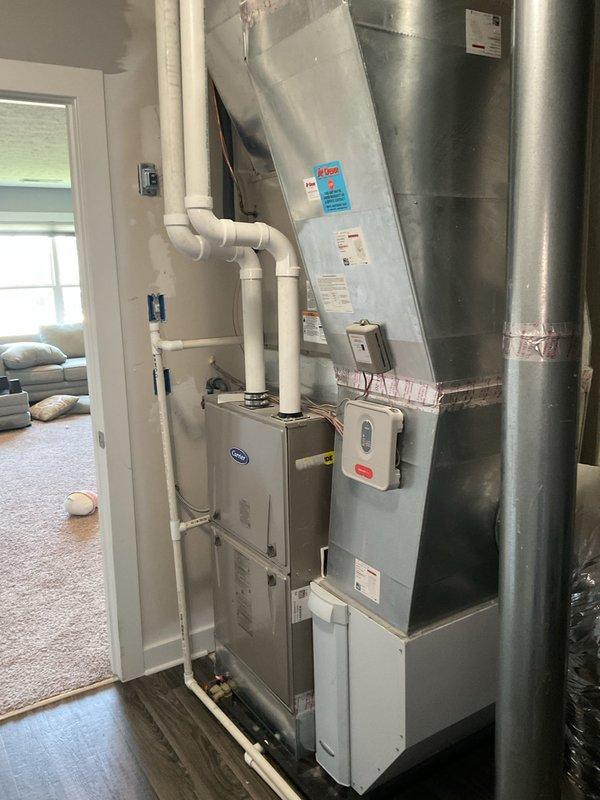 Responded to no-cool complaint on 6-year-old Carrier system with weak airflow to upstairs zone and excessive noise. Upon arrival, found thermostat displaying 75°F with setpoint at 70°F. Performed complete system diagnostics on indoor air handler and outdoor condensing unit. Inspected blower motor assembly and found reduced airflow due to restricted air filter and debris accumulation on evaporator coil. Replaced dirty air filter and cleaned evaporator coil to restore proper airflow. Checked refrigerant charge and operating pressures—system within manufacturer specifications. Identified source of excessive noise as loose blower wheel assembly; tightened set screws and verified balanced operation. Tested system operation across all zones, confirmed adequate airflow at upstairs registers and proper temperature differential across coil. System cooling effectively and operating within normal sound levels at departure.