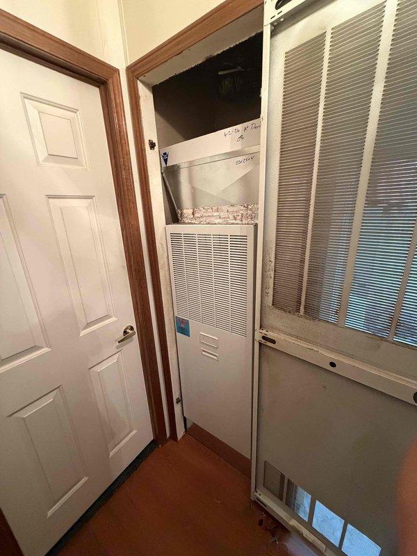 Completed installation of a 3.5-ton, 15.5 SEER heat pump system with matching air handler in a modular home in Boonville. The outdoor heat pump unit was positioned on a concrete pad adjacent to the home's exterior wall with proper clearances maintained, and refrigerant lines were connected and charged to manufacturer specifications. The indoor air handler was installed vertically in a dedicated utility closet with appropriate supply and return air ductwork connections to the existing plenum system.