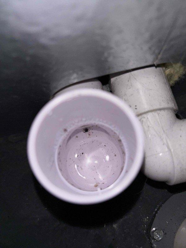 Responded to intermittent cooling complaint on 5-year-old residential HVAC system. Upon inspection, discovered severely corroded and oxidized copper wiring connections at capacitor and compressor contactor, with visible deterioration compromising electrical continuity. Identified moisture intrusion in condensate drain system evidenced by standing water with sediment accumulation in drain pan. Replaced deteriorated wiring connections, cleaned and tested capacitor for proper microfarad rating, verified contactor operation under load, and cleared condensate drain line obstruction. System cycled properly through multiple heating and cooling cycles with normal amperage draw and temperature differential across evaporator coil. Advised property owner of importance of regular maintenance to prevent future moisture-related electrical component degradation.