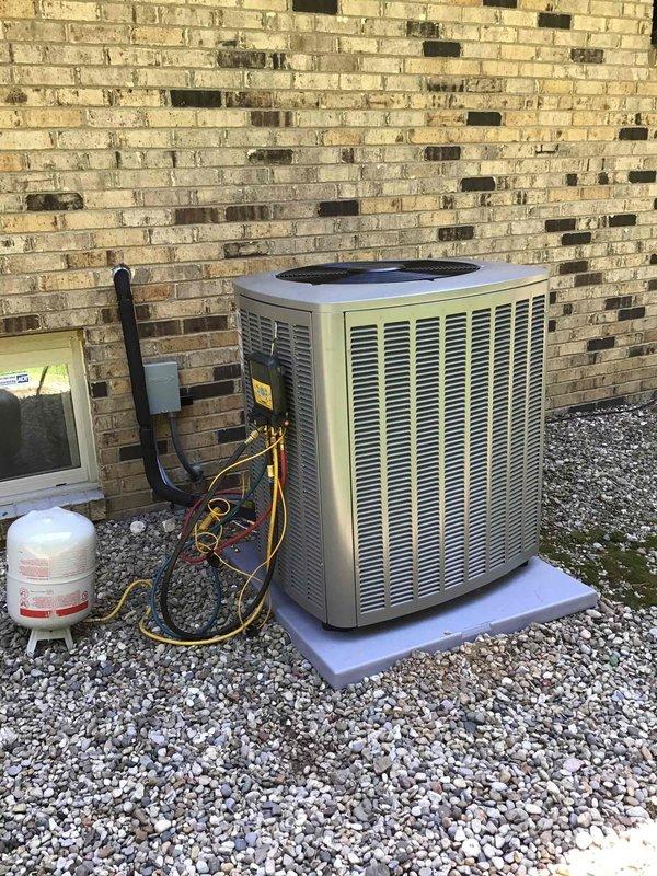 Completed full HVAC system installation including a 3-ton, 19 SEER heat pump outdoor unit and matching air handler with gas furnace backup. The outdoor condenser was positioned on a composite pad against the exterior brick wall with proper clearances maintained, electrical disconnect installed with code-compliant conduit routing, and refrigerant lines connected and charged to manufacturer specifications. Indoor equipment consisting of the air handler and A.O. Smith water heater was installed in the utility closet with proper venting, condensate drainage, and ductwork connections completed. All electrical connections were terminated, system startup procedures performed, and operational testing confirmed proper heating and cooling performance across all zones.