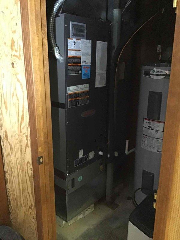 Completed full HVAC system installation including a 3-ton, 19 SEER heat pump outdoor unit and matching air handler with gas furnace backup. The outdoor condenser was positioned on a composite pad against the exterior brick wall with proper clearances maintained, electrical disconnect installed with code-compliant conduit routing, and refrigerant lines connected and charged to manufacturer specifications. Indoor equipment consisting of the air handler and A.O. Smith water heater was installed in the utility closet with proper venting, condensate drainage, and ductwork connections completed. All electrical connections were terminated, system startup procedures performed, and operational testing confirmed proper heating and cooling performance across all zones.