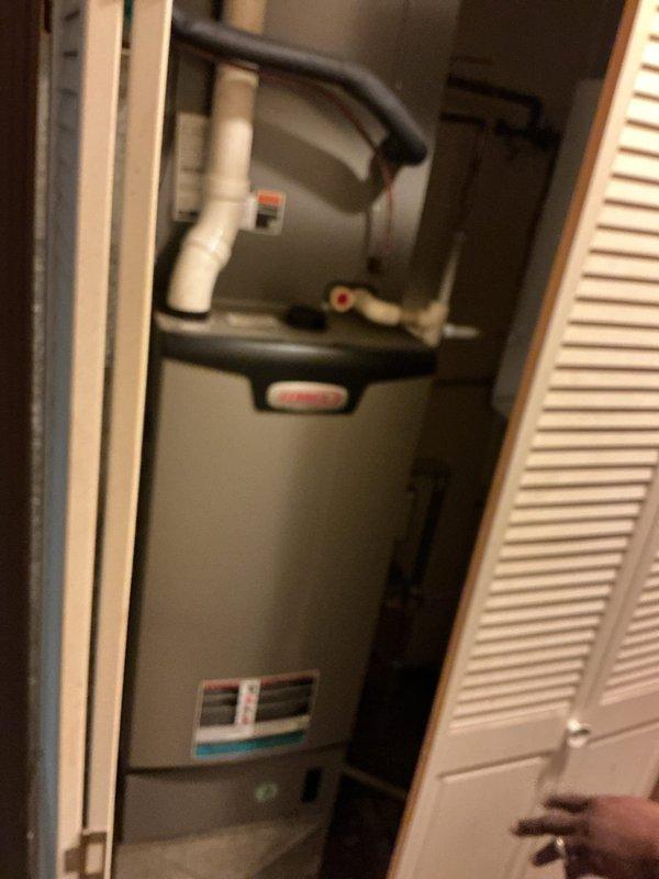 Completed routine AC tune-up on two-year-old air conditioning system. Performed comprehensive maintenance inspection of unit located in utility closet, verified all components operating within normal parameters, and documented system condition with photos. System confirmed to be functioning properly with no issues identified.