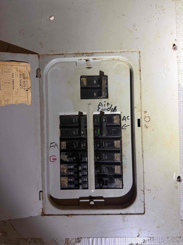 Responded to service callback for HVAC system with inadequate airflow following previous capacitor replacement. Upon arrival, performed comprehensive electrical system inspection and documented main electrical panel and circuit breaker configuration. Verified proper breaker operation for AC circuit, inspected wiring connections, and assessed power supply to HVAC unit to identify root cause of continued fan motor performance issues.