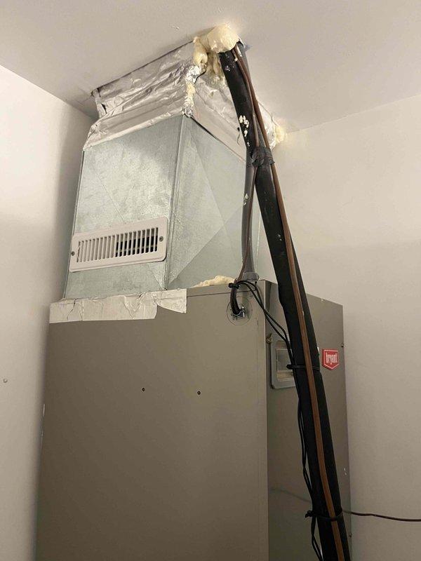 Conducted comprehensive indoor air quality assessment and HVAC system evaluation for residential property. Documented existing Bryant air handler installation in utility closet, including flexible ductwork connections, refrigerant line routing, and electrical conduit placement. Photographed secondary HVAC system featuring stacked configuration with furnace/air handler base unit and evaporator coil assembly, noting insulated ductwork connections and proper refrigerant line installation. Prepared detailed estimate for indoor air quality improvements based on current system conditions and customer requirements.