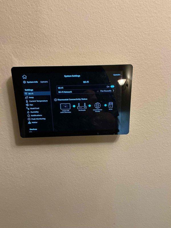 Completed scheduled AC tune-up and preventive maintenance service on residential air conditioning system. Performed comprehensive system diagnostics including electrical measurements using clamp meter, which indicated 220.6V supply voltage and 7.0A current draw within normal operating parameters. Verified smart thermostat connectivity and Wi-Fi network connection functioning properly with all system settings accessible through digital interface.