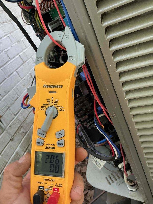 Completed scheduled AC tune-up and preventive maintenance service on residential air conditioning system. Performed comprehensive system diagnostics including electrical measurements using clamp meter, which indicated 220.6V supply voltage and 7.0A current draw within normal operating parameters. Verified smart thermostat connectivity and Wi-Fi network connection functioning properly with all system settings accessible through digital interface.