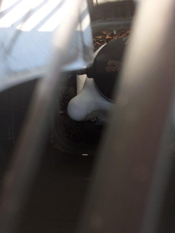 Responded to no cooling complaint on 5-year-old residential system with reduced airflow and inability to maintain setpoint temperature. Upon arrival, discovered entire system frozen from evaporator coil through refrigerant lines to outdoor compressor unit. Advised customer to switch thermostat to fan-only mode to allow system to defrost before diagnostic work could be performed, requiring afternoon return visit to complete proper assessment and repairs once ice had melted.