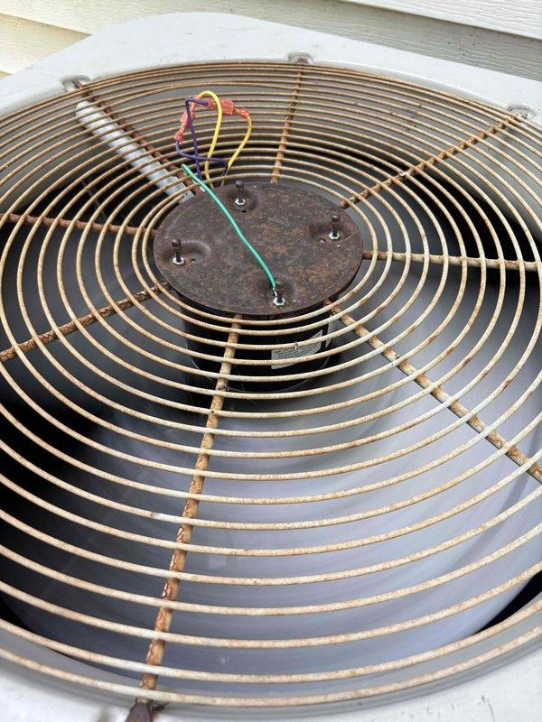 Responded to a no-cool service call on a 10+ year old residential HVAC system that had been non-operational since the previous summer. Upon arrival, performed comprehensive diagnostic evaluation of the outdoor condenser unit and indoor air handler. System showed signs of age with visible corrosion on fan guard and previous repair attempts including motor and capacitor replacement. Diagnosed primary failure points preventing system operation and lack of airflow through vents. Completed necessary repairs to restore cooling functionality to the unit.