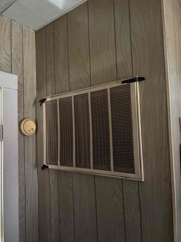 Responded to a no-cool service call on a 10+ year old residential HVAC system that had been non-operational since the previous summer. Upon arrival, performed comprehensive diagnostic evaluation of the outdoor condenser unit and indoor air handler. System showed signs of age with visible corrosion on fan guard and previous repair attempts including motor and capacitor replacement. Diagnosed primary failure points preventing system operation and lack of airflow through vents. Completed necessary repairs to restore cooling functionality to the unit.