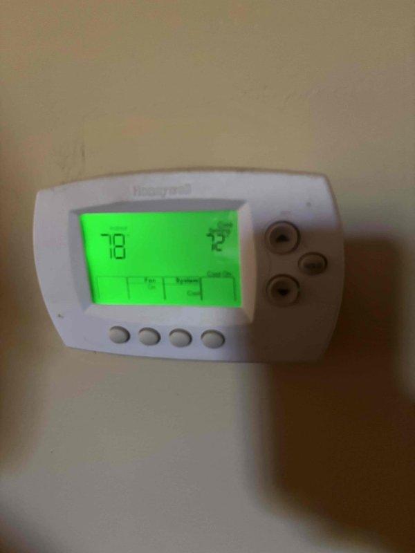 Responded to no cooling call on 7-year-old residential air conditioning system. Upon arrival, verified thermostat was calling for cooling with display showing 78°F actual temperature and 75°F setpoint. Proceeded to outdoor condensing unit to perform diagnostic testing. Using digital multimeter, tested electrical components and identified failed dual-run capacitor with reading of 438 volts during system operation. Replaced defective capacitor with manufacturer-specified replacement unit. Cycled system through complete operational test, confirmed proper voltage readings, verified compressor and condenser fan motor startup, and restored full cooling functionality to the system.
