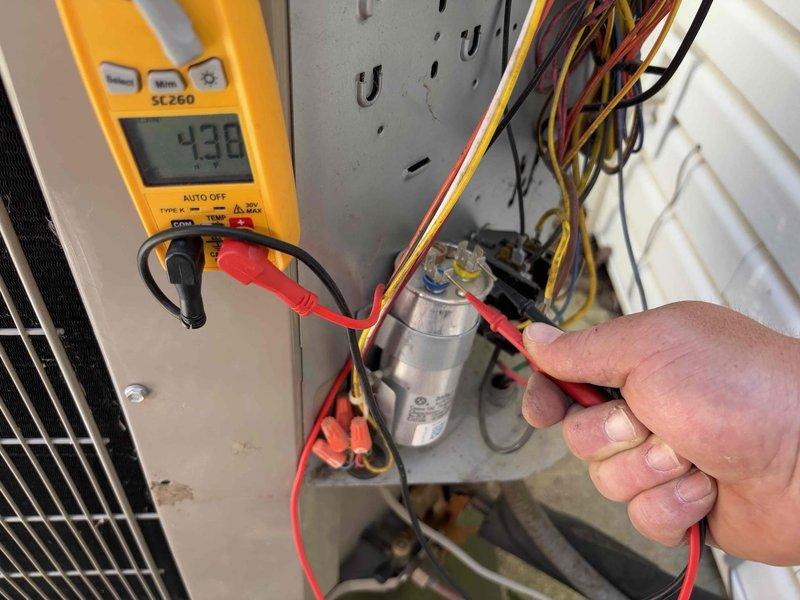 Responded to no cooling call on 7-year-old residential air conditioning system. Upon arrival, verified thermostat was calling for cooling with display showing 78°F actual temperature and 75°F setpoint. Proceeded to outdoor condensing unit to perform diagnostic testing. Using digital multimeter, tested electrical components and identified failed dual-run capacitor with reading of 438 volts during system operation. Replaced defective capacitor with manufacturer-specified replacement unit. Cycled system through complete operational test, confirmed proper voltage readings, verified compressor and condenser fan motor startup, and restored full cooling functionality to the system.