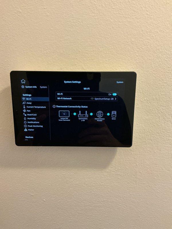 Completed follow-up visit for previously installed thermostat where initial maintenance work remained outstanding. Verified smart thermostat installation and configuration, confirmed Wi-Fi connectivity to SpectrumSetup-3D network, validated system settings interface functionality, and ensured automatic updates feature enabled and operational for proper system performance.