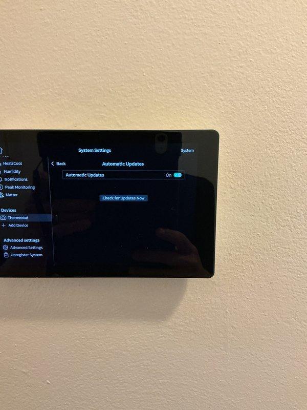 Completed follow-up visit for previously installed thermostat where initial maintenance work remained outstanding. Verified smart thermostat installation and configuration, confirmed Wi-Fi connectivity to SpectrumSetup-3D network, validated system settings interface functionality, and ensured automatic updates feature enabled and operational for proper system performance.