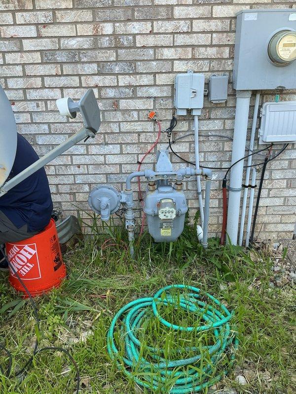 Conducted comprehensive on-site evaluation for complete HVAC system replacement. Assessed existing Carrier furnace installation and associated ductwork configuration in residential garage utility closet, documented current equipment specifications and spatial constraints for new system design. Photographed exterior gas meter connections, electrical service panel locations, and interior mechanical room layout to determine optimal equipment sizing and installation requirements for Green - A+ rated replacement system.