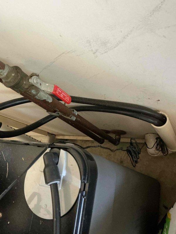 Conducted on-site assessment for water softener installation in mechanical room. Evaluated existing plumbing infrastructure, including water supply lines, drainage access, and available space near current water heater and HVAC equipment. Documented existing conditions showing aged flexible connectors, copper piping, and floor-level moisture concerns. Photographed installation area to determine optimal placement for new water softener unit, verify compatibility with current system configuration, and identify any necessary modifications to accommodate proper installation and future maintenance access.