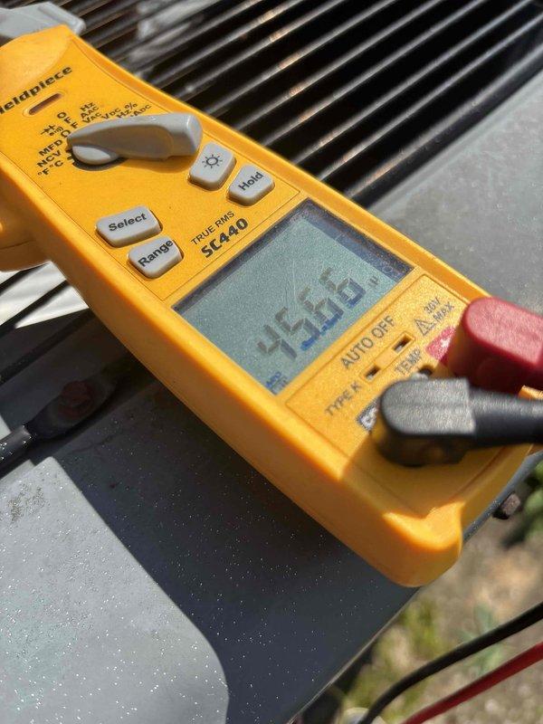 Completed routine AC tune-up and preventive maintenance inspection. Verified system voltage readings at 243.9V using digital multimeter, inspected evaporator coil and filter assembly for cleanliness and proper airflow, and documented equipment condition through photos. No issues or deficiencies identified during inspection; system operating within normal parameters.