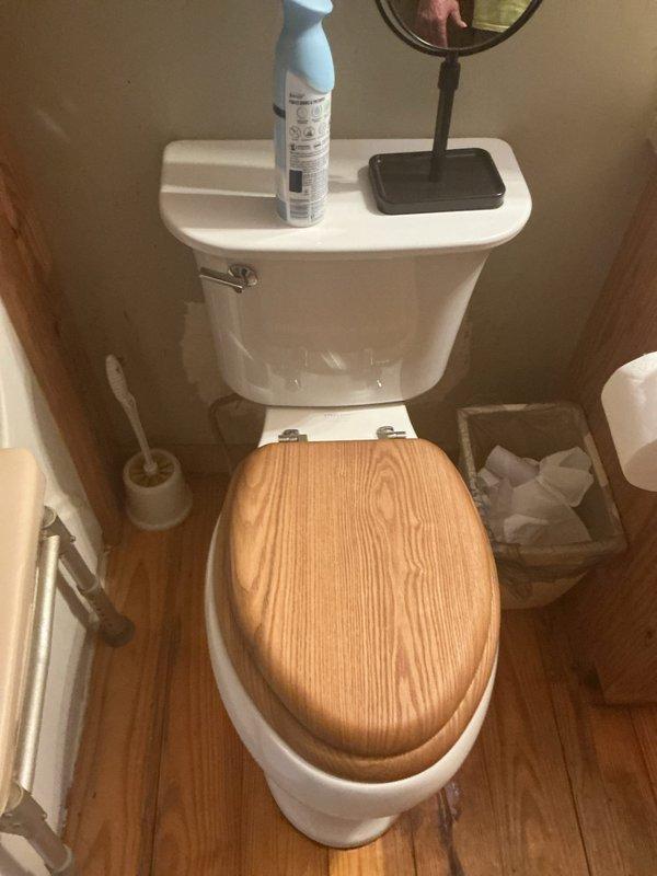 Responded to service call for toilet replacement at residential property with issues on two levels. Downstairs toilet exhibited instability due to potentially broken mounting bolts and had visible cracking at the base of the bowl, creating structural compromise and potential leak hazard. Upstairs toilet was improperly positioned too close to the wall, limiting accessibility and potentially violating clearance requirements. Performed comprehensive assessment of both fixtures, documented existing conditions including floor staining near downstairs unit indicating possible previous water intrusion, and evaluated feasibility of repositioning upstairs installation. Provided replacement recommendations for both toilets to address structural damage and improve fixture placement for proper clearances and code compliance.