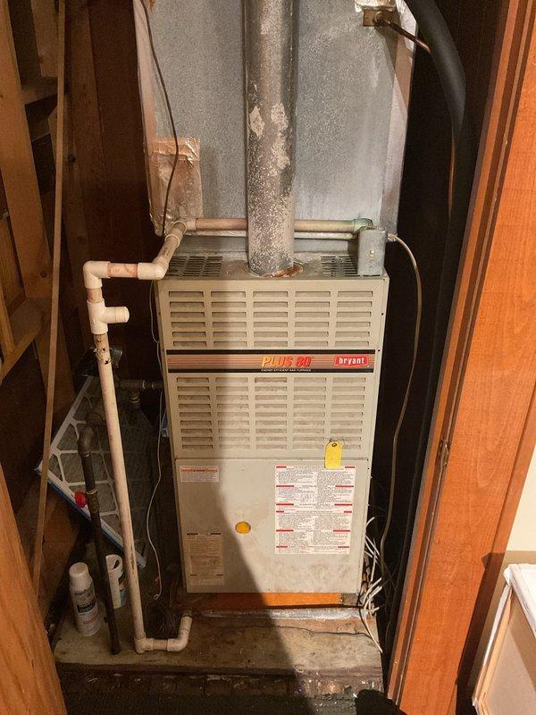 Responded to no cooling complaint on 15-year-old Bryant PLUS 90 system utilizing R22 refrigerant. Diagnosed low refrigerant charge as cause of inadequate cooling performance. Recharged system with R22 refrigerant to manufacturer specifications and verified proper operation of condenser unit and indoor air handler. System returned to normal cooling operation with no evidence of evaporator coil icing or other secondary issues.