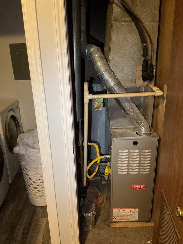 Responded to no cooling complaint on 10+ year old Bryant system located in basement utility area. Upon arrival, confirmed system was running but blowing warm air with no cooling capacity. Performed diagnostic evaluation of condensing unit and air handler, identifying failed compressor and age-related component deterioration. Due to system age and extent of repairs needed, provided customer with repair versus replacement options and recommendations for upgraded equipment to restore cooling functionality.