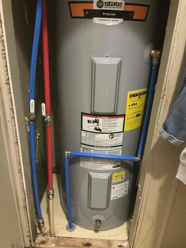 Installed a 40-gallon State ProLine Commercial Grade electric water heater in utility closet. Connected hot and cold water supply lines using PEX piping with brass fittings, installed pressure relief valve with discharge pipe, and verified all connections for proper operation and code compliance.