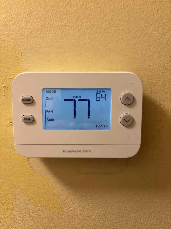 Responded to callback for system not cooling after previous service visit where core sense was bypassed and amp draws verified normal operation. Upon arrival, found extremely dirty air filter causing restricted airflow and reduced cooling capacity. Replaced filter and verified thermostat operation showing system set to 54°F with cool mode engaged. System cycling properly with adequate airflow restored after filter replacement.
