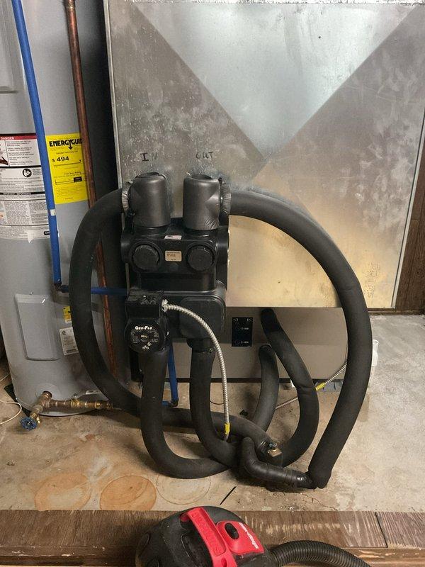 Responded to no-cool call on 10-year-old geothermal heat pump system with non-operational indoor circulation pump. Diagnosed failed Geo-Flo circulation pump preventing proper refrigerant flow through ground loop system, causing compressor to run without adequate heat exchange. Replaced defective circulation pump with new unit, verified proper electrical connections, purged air from hydronic loop, and tested system operation. System restored to full cooling capacity with proper flow rates confirmed and all safety controls functioning within manufacturer specifications.