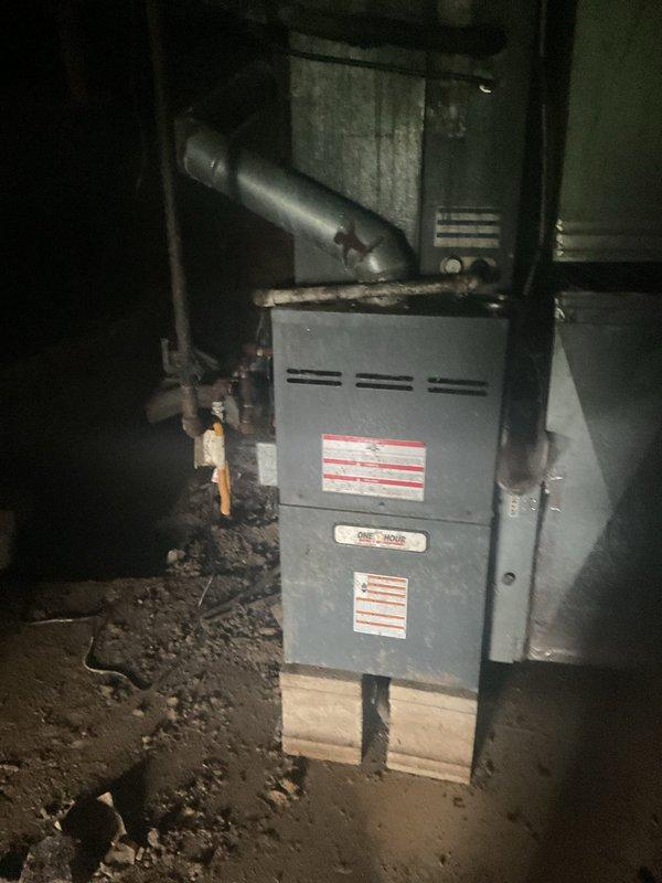 Responded to no cooling call on residential split system approximately 15+ years old. Upon arrival, system was already shut down due to customer-reported freezing and suspected refrigerant leak. Performed visual inspection of outdoor condenser unit and indoor furnace/evaporator assembly. Confirmed signs of ice accumulation and potential refrigerant loss. Conducted leak detection procedures and identified refrigerant leak requiring repair. Provided assessment of system condition given age of equipment and discussed repair versus replacement options with homeowner due to advanced age of unit and efficiency considerations for ongoing cooling needs.