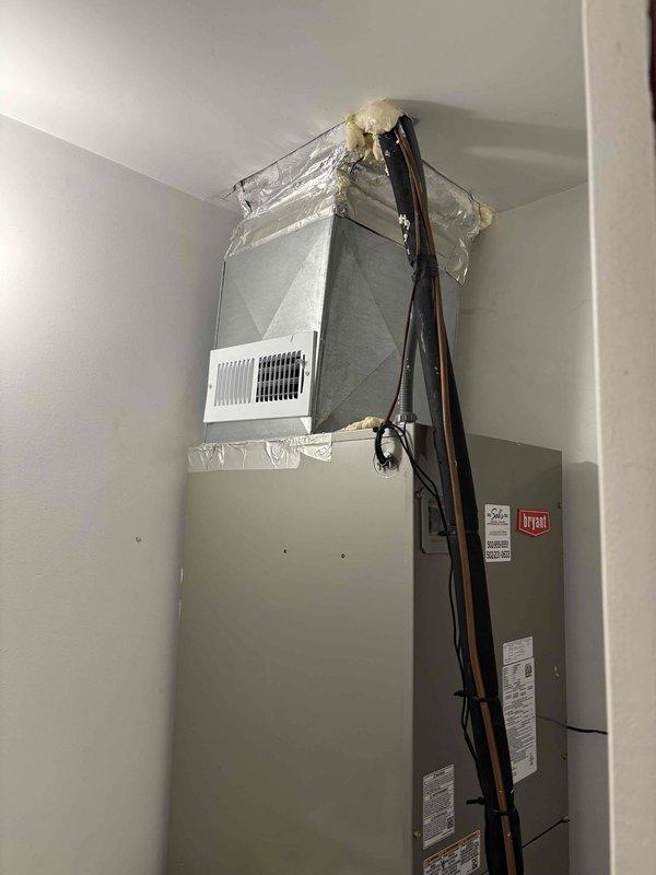 Completed installation of I-Wave air purification system on existing Bryant HVAC unit and added two new supply registers to the ductwork system. All components were properly mounted, sealed with foam insulation at connection points, and tested for proper operation to enhance indoor air quality.