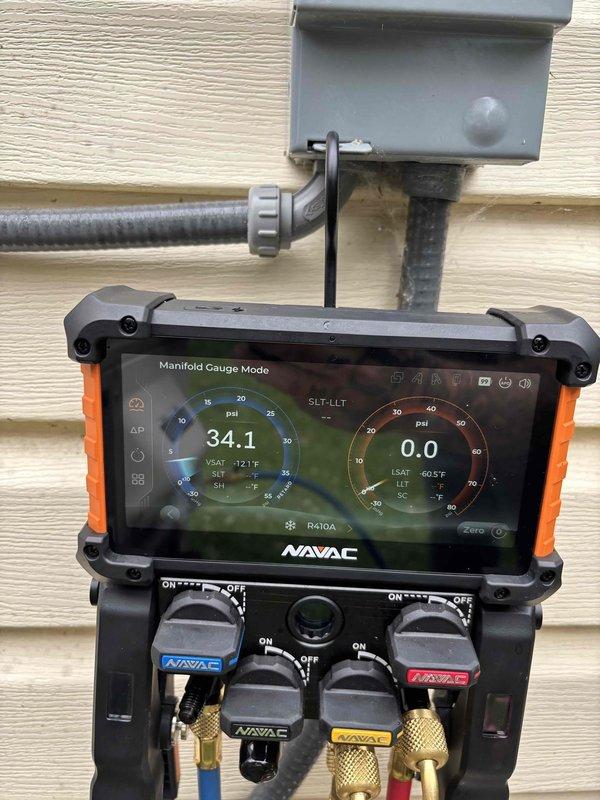 Responded to service call for one-year-old mini split system in bedroom experiencing intermittent loud crunching/grinding noise lasting approximately one minute before returning to normal operation. Performed diagnostic evaluation of indoor and outdoor units. Measured supply air temperature at 48.3°F confirming cooling functionality. Connected manifold gauges to refrigerant lines and recorded operating pressures at 34.1 PSI on low side with 0.0 PSI on high side during diagnostic testing. System currently operational with adequate airflow and cooling capacity maintained.