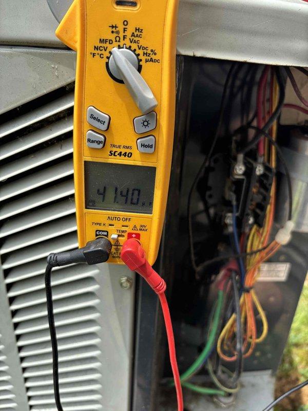 Completed planned maintenance on 13-year-old residential HVAC system. Performed electrical diagnostics using digital multimeter, verifying system voltage and component functionality. Inspected outdoor condensing unit with access panel removed, examining TITAN PRO capacitor, contactors, relays, and control board. Verified proper wire connections throughout unit including power and control wiring. System operating within normal parameters. Recommended 16x25x1 filter replacement for continued optimal performance.