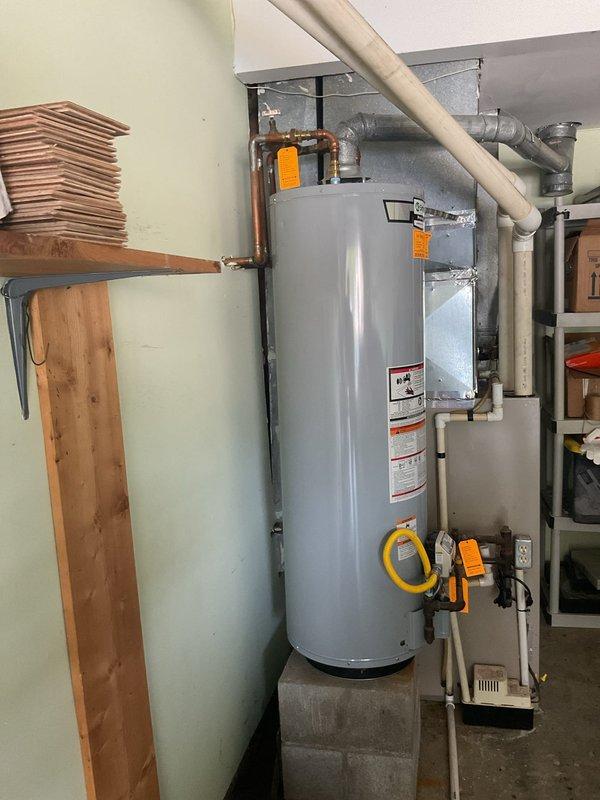 Conducted comprehensive site assessment for cooling system replacement at medium-sized residential property (1600-2200 sq.ft.). Evaluated existing HVAC infrastructure located in garage area, including air handler unit with galvanized ductwork, associated mechanical systems, and utility connections. Documented current equipment configuration and mechanical room layout to provide replacement options for 25-year-old cooling system, photographing existing installation including ductwork routing, PVC plumbing connections, and spatial constraints for new equipment installation.