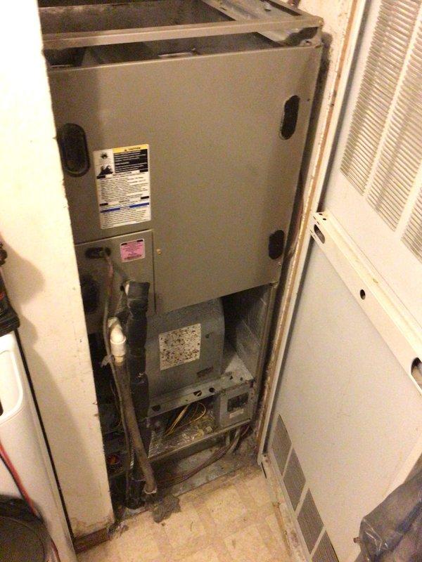 Responded to no-cool service call on 11-year-old system with frost buildup and complete failure to power on. Upon arrival, found air handler in utility closet with extensive evaporator coil icing and unit unresponsive to thermostat commands. Accessed internal components by removing lower access panel and front cabinet to inspect blower assembly, electrical connections, and refrigerant circuit. Diagnosed frozen evaporator coil due to restricted airflow caused by severely clogged air filter and accumulated debris within blower housing. Secondary issue identified: faulty capacitor preventing compressor from starting, contributing to system shutdown. Removed obstruction from blower wheel, replaced air filter, and installed new dual-run capacitor. Allowed adequate defrost time before testing system operation. Verified proper airflow through supply vents, confirmed compressor engagement, and monitored refrigerant pressures to ensure system returned to normal cooling operation. Advised proper