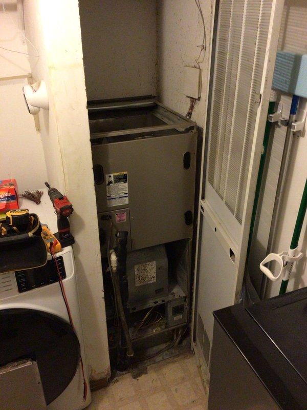 Responded to no-cool service call on 11-year-old system with frost buildup and complete failure to power on. Upon arrival, found air handler in utility closet with extensive evaporator coil icing and unit unresponsive to thermostat commands. Accessed internal components by removing lower access panel and front cabinet to inspect blower assembly, electrical connections, and refrigerant circuit. Diagnosed frozen evaporator coil due to restricted airflow caused by severely clogged air filter and accumulated debris within blower housing. Secondary issue identified: faulty capacitor preventing compressor from starting, contributing to system shutdown. Removed obstruction from blower wheel, replaced air filter, and installed new dual-run capacitor. Allowed adequate defrost time before testing system operation. Verified proper airflow through supply vents, confirmed compressor engagement, and monitored refrigerant pressures to ensure system returned to normal cooling operation. Advised proper