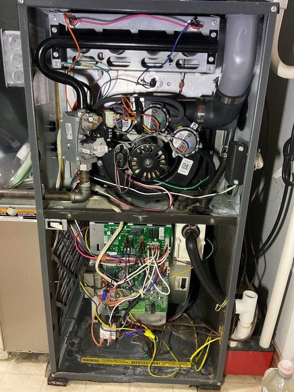 Completed annual Platinum Level maintenance on 9-year-old HVAC system during second visit of the service period. Performed comprehensive inspection of Aspen refrigerant evaporator coil (Model CG36B3417SR157) with R-410A refrigerant and confirmed proper operation. Accessed furnace unit and thoroughly inspected internal components including heat exchanger assembly, burner components, blower motor assembly, gas valves, pressure switches, and control board with all electrical connections. Verified all wiring connections across upper and lower compartments remained secure and properly terminated. Inspected condensate drain line for proper drainage. Documented equipment condition through photographic records showing all major components and manufacturer specifications. System operational and ready for continued service with renewal period approaching.