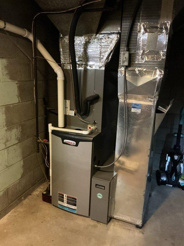 Completed comprehensive Platinum Level maintenance on single-zone Lennox HVAC system during second annual visit. Performed full inspection and servicing of indoor furnace unit located in basement mechanical room and outdoor condensing unit positioned on exterior concrete pad. Replaced 16x25x5 air filter and conducted complete system performance evaluation. Inspected all electrical connections, refrigerant lines, condensate drainage, and ductwork connections. Verified proper operation of both heating and cooling components. Checked thermostat calibration and system controls for optimal performance. Cleaned condenser coils on outdoor unit and cleared area of debris. Inspected PVC venting and flue connections on furnace. Tested safety controls and confirmed all equipment operating within manufacturer specifications. System is one year old and performing efficiently. Customer due for renewal of maintenance agreement.
