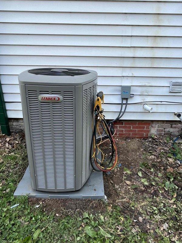# HVAC Install - Complete System

Completed installation of 3-ton, 18 SEER Lennox air conditioning system at residential property. Installed outdoor condensing unit on concrete pad against exterior wall with proper electrical connections and disconnect box. Performed system startup and commissioning procedures, including refrigerant charge verification using Fieldpiece SMAN manifold gauges. Measured and documented system pressures at 136.1 PSIG low side and 314.0 PSIG high side, confirming proper refrigerant charge and system operation. All electrical connections secured and tested for proper voltage and amperage. System operating within manufacturer specifications with appropriate temperature differentials across the coil.