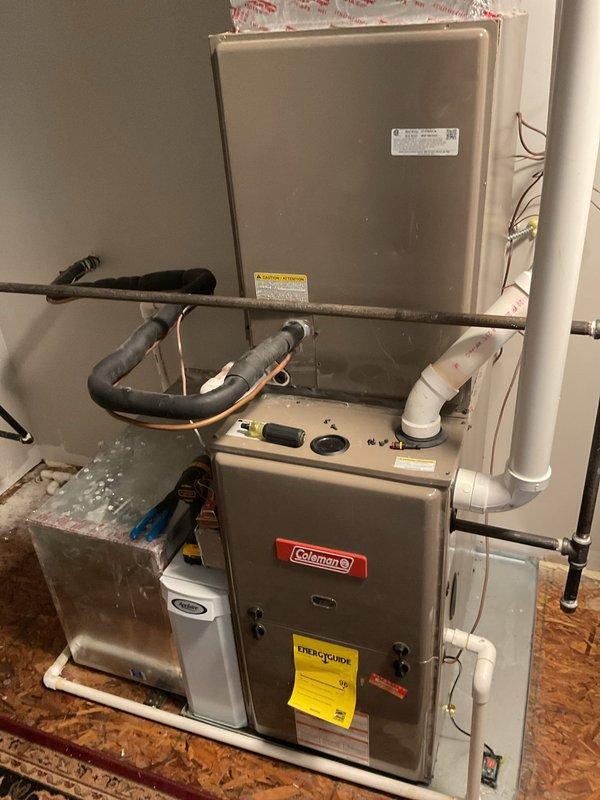 Responded to urgent water leak from 4-year-old HVAC system on second floor causing water damage to main floor below. Upon inspection, identified condensate drainage issue affecting the air handler unit. Cleared blocked condensate drain line, verified proper drainage flow, tested system operation to ensure leak was resolved and unit returned to normal cooling function.