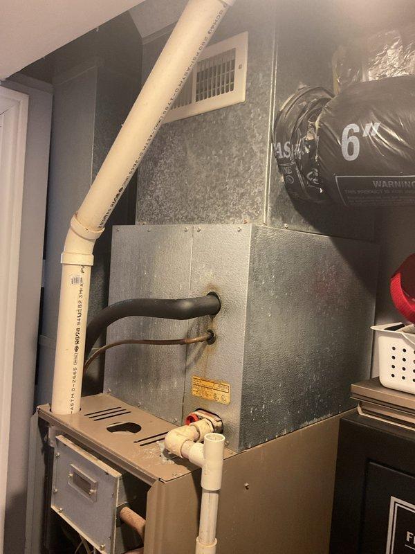 Completed comprehensive replacement estimate for residential gas furnace and air conditioning system after existing unit failure. Evaluated interior furnace installation in utility closet with associated ductwork, flexible connections, and PVC condensate drainage, as well as outdoor condensing unit positioned on gravel bed against house exterior. Documented current system configuration, photographed equipment conditions, and provided customer with financing options for complete HVAC system replacement.