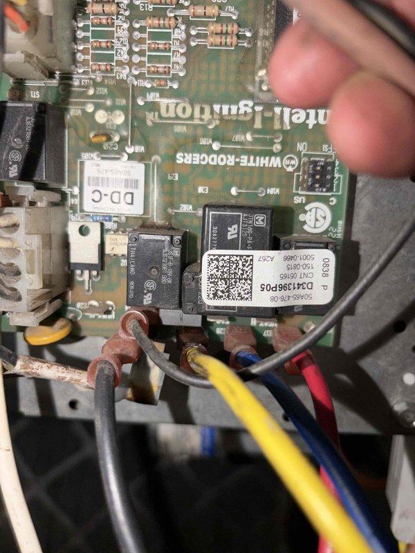Responded to no cooling call on 3-year-old system with frozen evaporator coil. Upon arrival, confirmed ice buildup and instructed occupant to switch system to fan-only mode to initiate defrost process. Inspected White-Rodgers InteliHARMONY control board for proper operation and verified all electrical connections and wiring terminals were secure. Property has secondary cooling system available during defrost period.