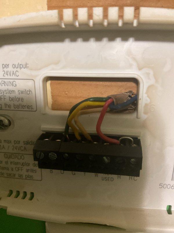 Conducted comprehensive replacement estimate for aging HVAC system over 15 years old that is currently operational but nearing end of service life. Evaluated existing thermostat wiring configuration showing 24VAC connections with standard color-coded wiring to terminal block, and assessed electrical service panel with main breaker and circuit distribution to ensure adequate power supply for new equipment installation. Documented system specifications and captured detailed photos of control wiring and electrical infrastructure to develop accurate replacement proposal and equipment sizing recommendations.